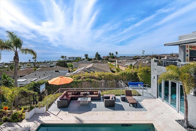 view of pool with an outdoor living space and a patio