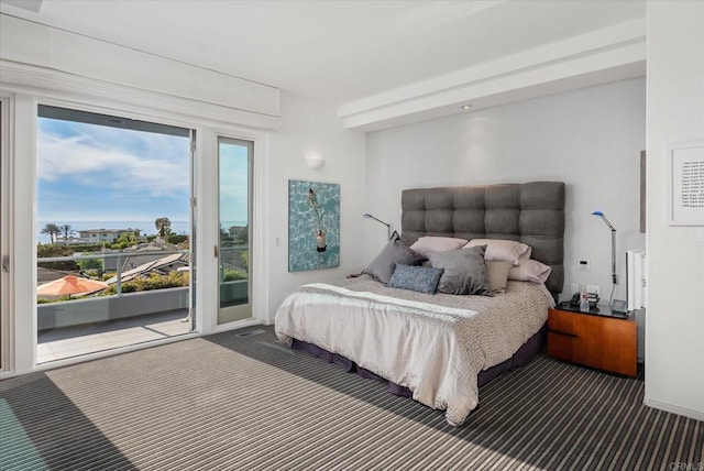 carpeted bedroom featuring access to exterior