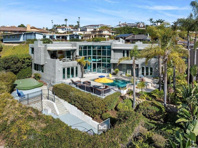 back of house with a patio