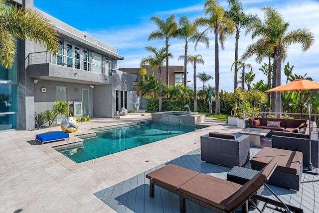 view of pool featuring an in ground hot tub, an outdoor hangout area, and a patio