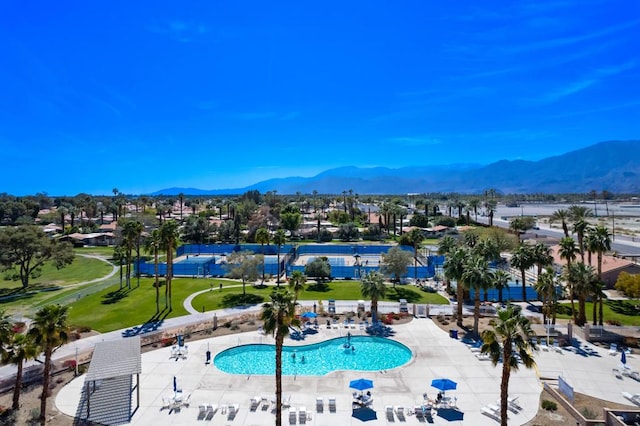 view of pool featuring a patio and a mountain view