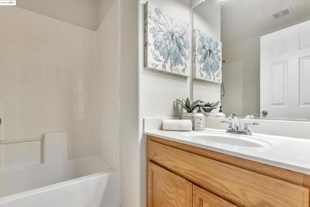 bathroom with vanity and shower / tub combination