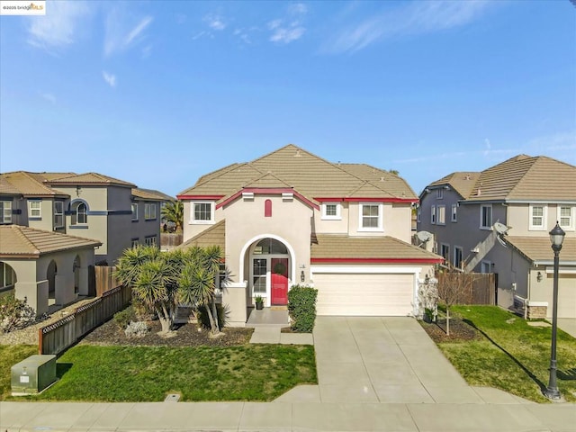 view of front of house with a garage and a front yard