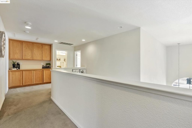 kitchen featuring light colored carpet