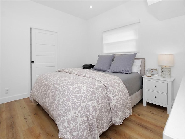 bedroom with light hardwood / wood-style flooring