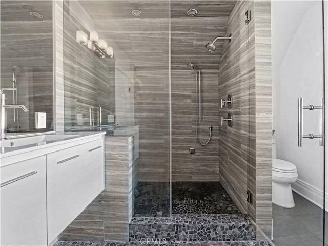 bathroom with vanity, an enclosed shower, and toilet