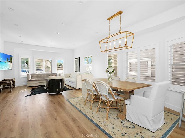 dining space featuring a healthy amount of sunlight and light wood-type flooring