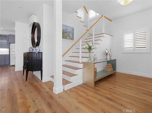 stairs with wood-type flooring