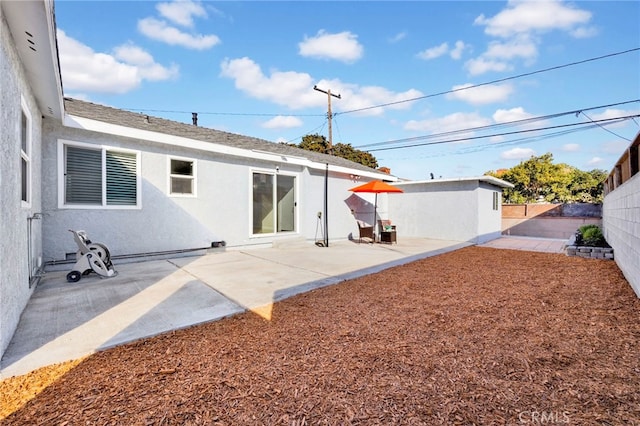 back of property featuring a patio area