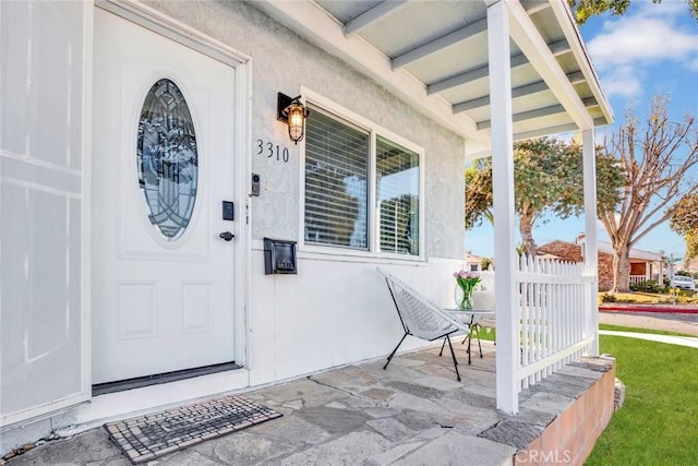 property entrance with a porch