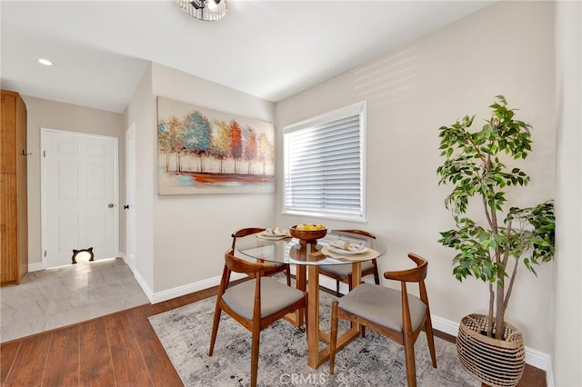 dining area featuring dark hardwood / wood-style flooring