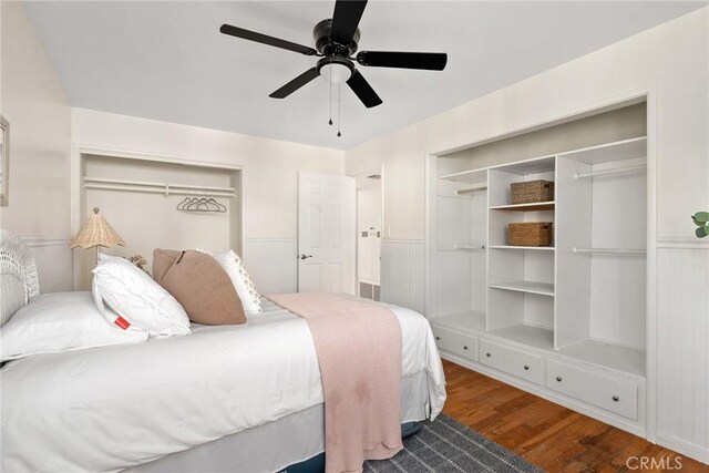 bedroom with ceiling fan, wood-type flooring, and a closet