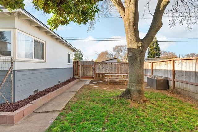 view of yard with central AC unit