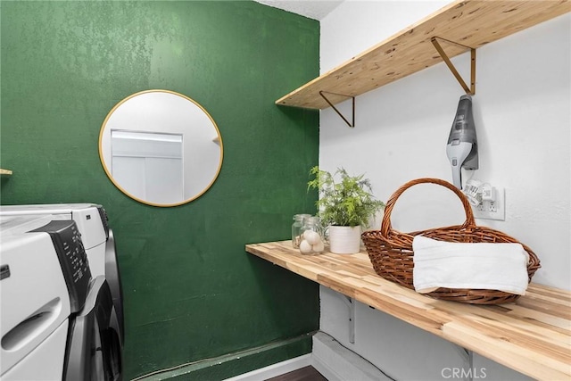 laundry area with washing machine and clothes dryer