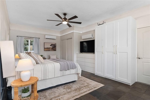 bedroom with an AC wall unit and ceiling fan