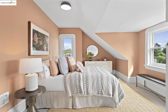 bedroom featuring lofted ceiling