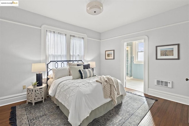 bedroom featuring dark hardwood / wood-style flooring