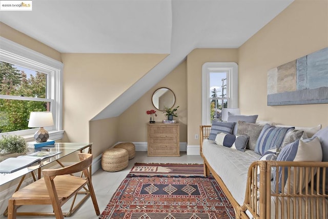 sitting room with lofted ceiling