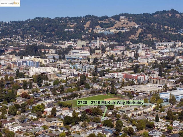 birds eye view of property with a mountain view