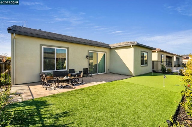 rear view of house with a patio area