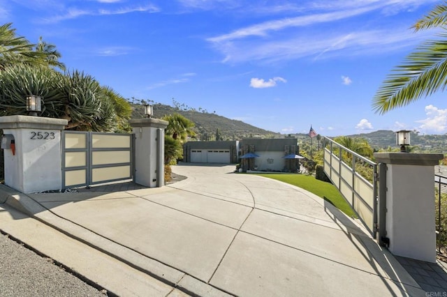 view of gate featuring a mountain view