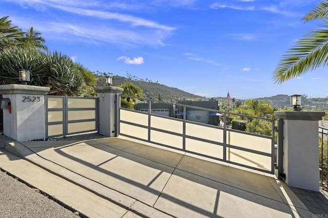 view of gate with a mountain view