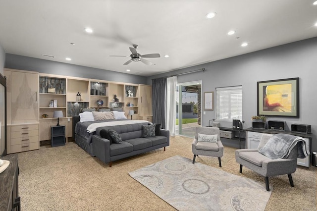 bedroom featuring ceiling fan, access to exterior, and light colored carpet