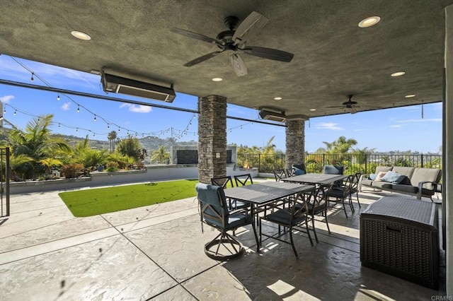 view of patio featuring an outdoor living space and ceiling fan