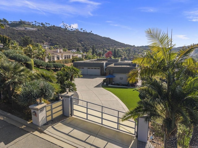 view of front of property featuring a mountain view and a garage