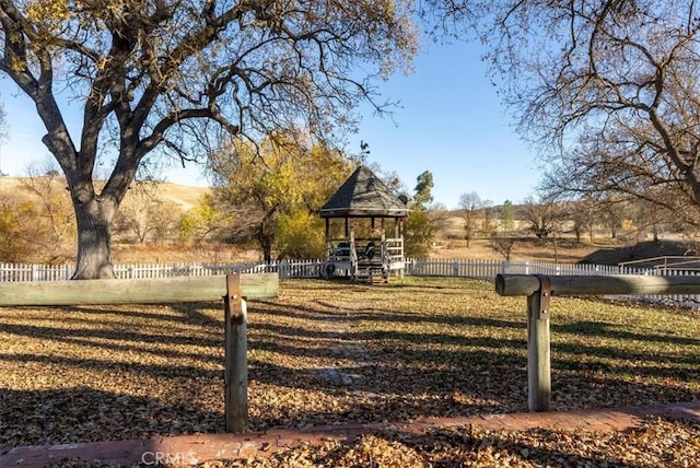 exterior space with a gazebo and a rural view