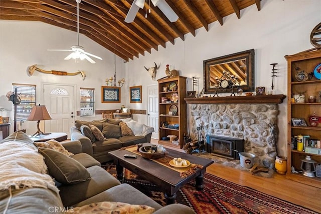 living room featuring hardwood / wood-style flooring, lofted ceiling with beams, and ceiling fan