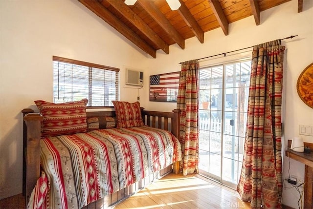 bedroom featuring vaulted ceiling with beams, hardwood / wood-style flooring, ceiling fan, access to exterior, and multiple windows