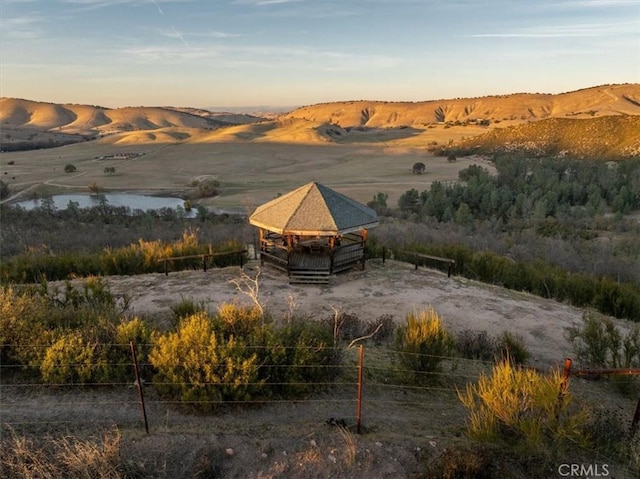 exterior space with a gazebo and a mountain view