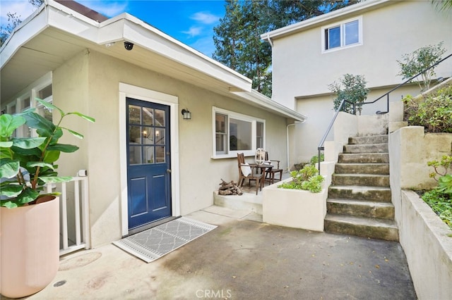 entrance to property with a patio