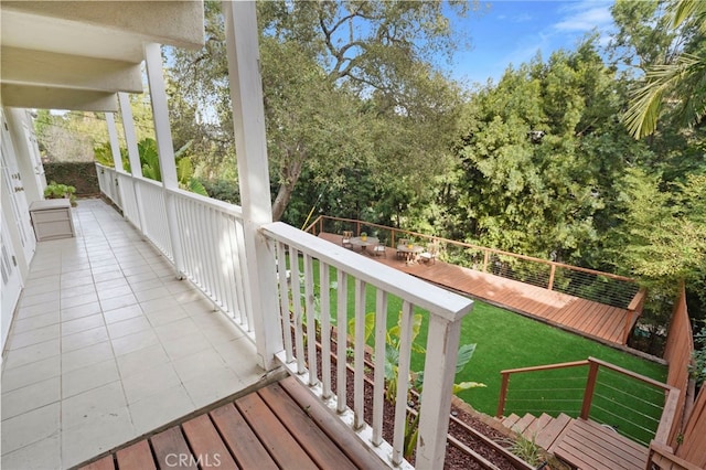 wooden deck with a lawn