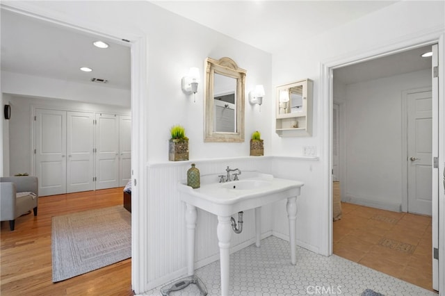 bathroom featuring wood-type flooring