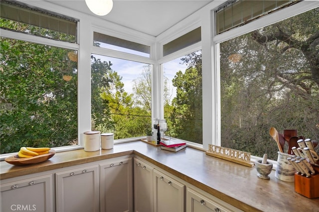 unfurnished sunroom featuring a wealth of natural light