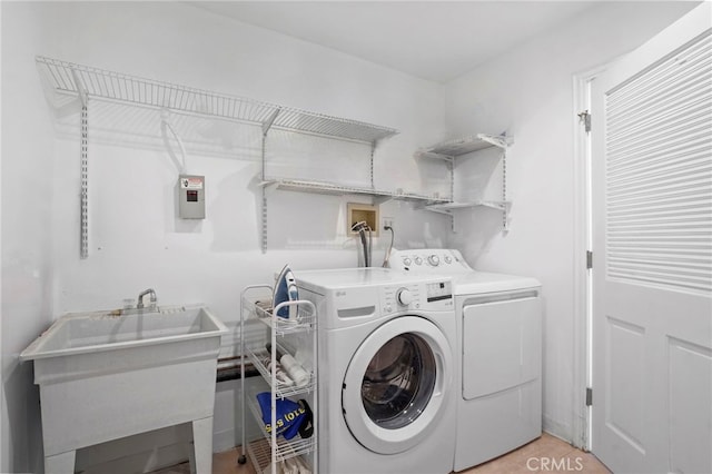 laundry room featuring separate washer and dryer and sink