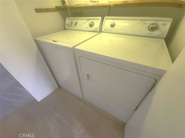 washroom featuring washing machine and dryer