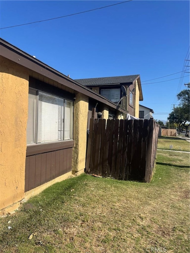 view of home's exterior with a lawn