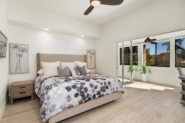 bedroom featuring light wood-type flooring, access to exterior, and ceiling fan