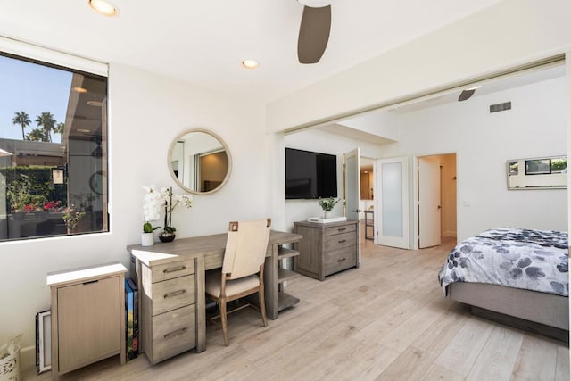 bedroom with ensuite bathroom, ceiling fan, and light wood-type flooring