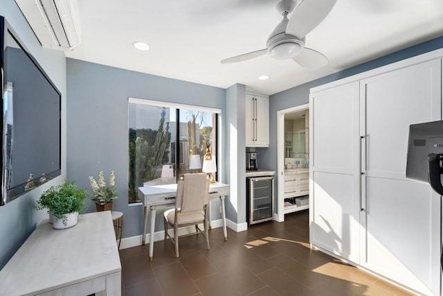 kitchen featuring white cabinetry, a wall mounted air conditioner, beverage cooler, and ceiling fan