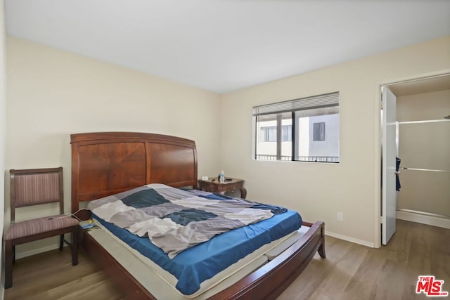 bedroom with light hardwood / wood-style floors