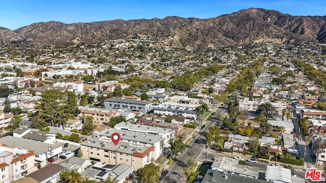 birds eye view of property with a mountain view