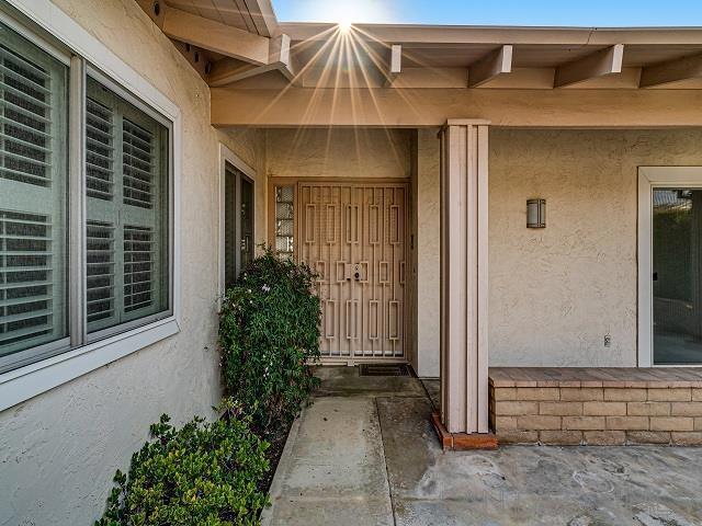 property entrance featuring a patio area