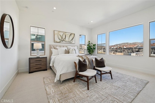 carpeted bedroom featuring a mountain view