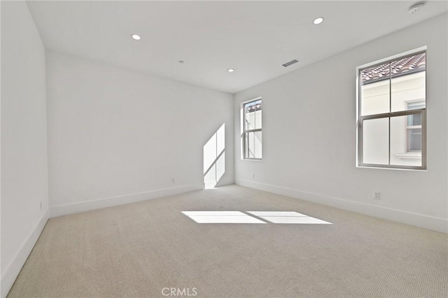 empty room with light colored carpet