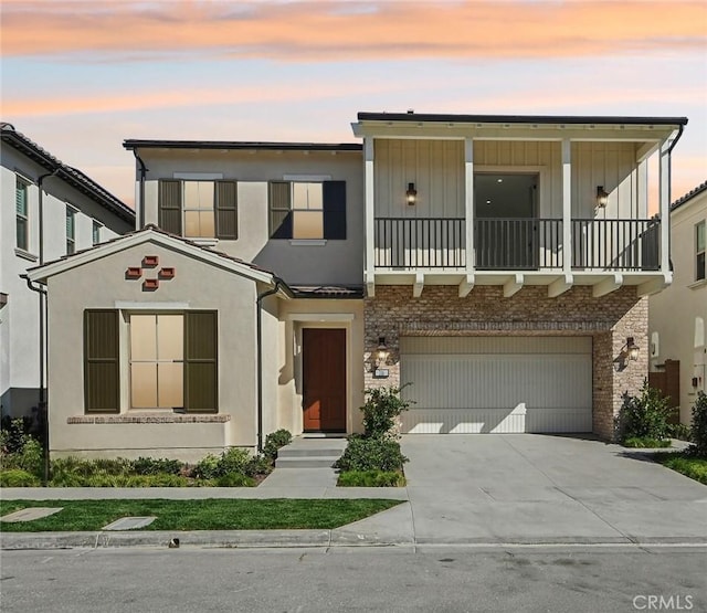 view of front of house with a garage and a balcony