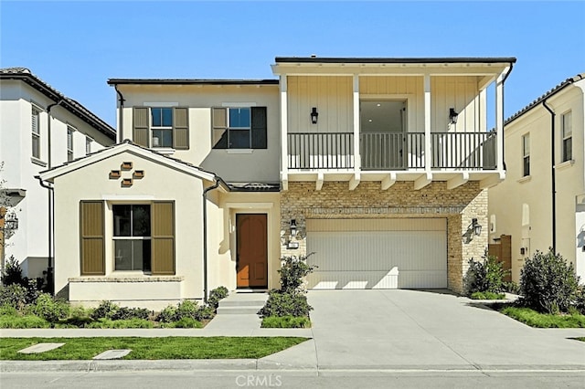 view of front facade featuring a balcony and a garage